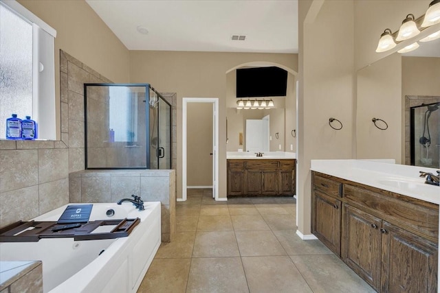 full bath featuring a garden tub, visible vents, a stall shower, a sink, and tile patterned floors