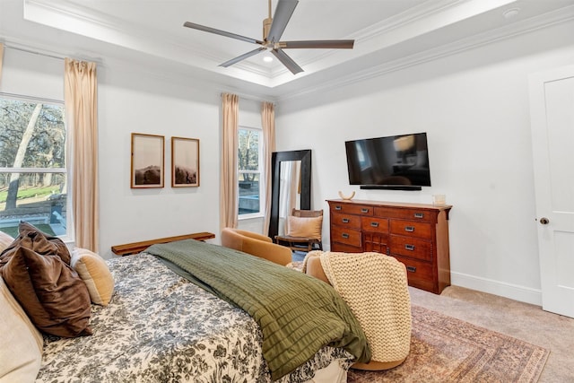 bedroom featuring baseboards, light colored carpet, ornamental molding, a tray ceiling, and recessed lighting