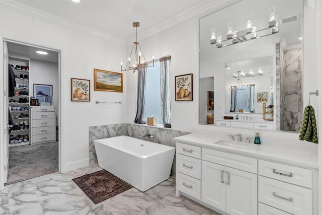 full bath with vanity, visible vents, marble finish floor, ornamental molding, and a soaking tub