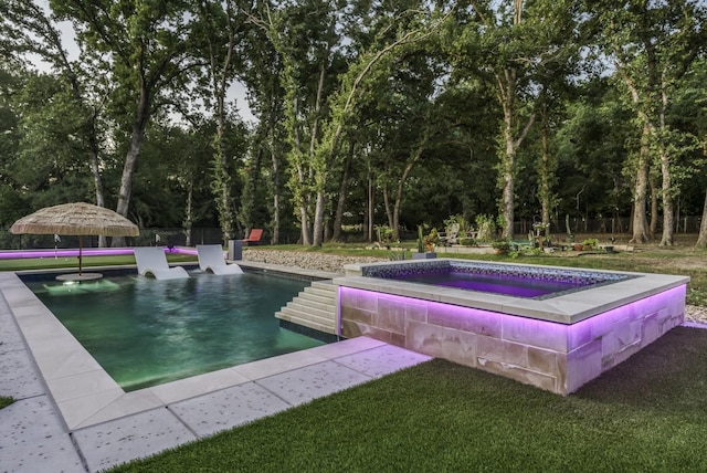 pool with fence and a lawn