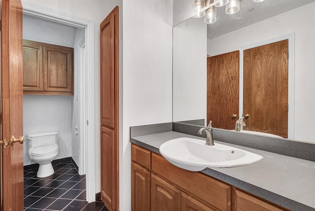 bathroom with tile patterned floors, toilet, and vanity