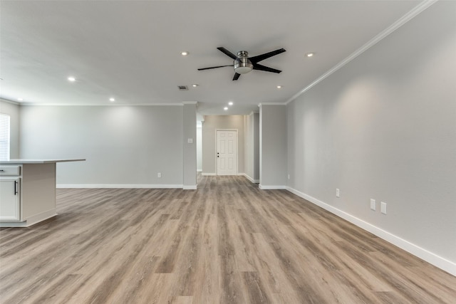 unfurnished living room with baseboards, light wood-style flooring, recessed lighting, ceiling fan, and crown molding