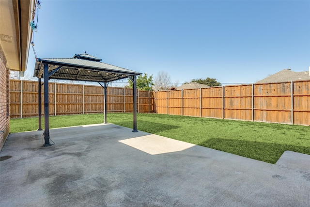 view of patio / terrace with a gazebo and a fenced backyard