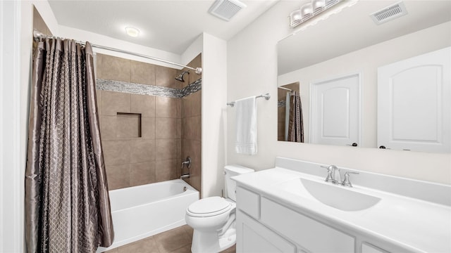 full bathroom featuring toilet, tile patterned flooring, visible vents, and vanity