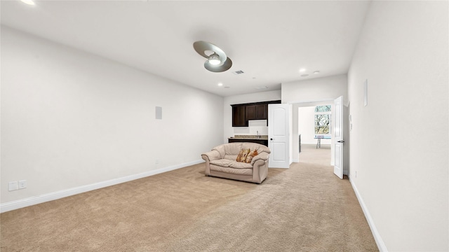 unfurnished room with baseboards, recessed lighting, visible vents, and light colored carpet