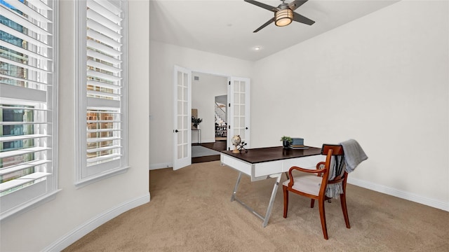 carpeted office with a ceiling fan, french doors, and baseboards