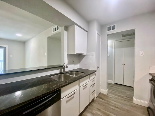 kitchen with light wood-style floors, visible vents, a sink, and dishwasher