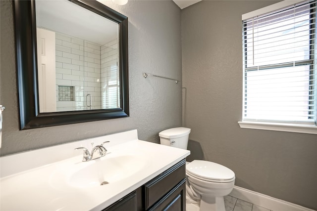 full bathroom with a textured wall, toilet, vanity, baseboards, and marble finish floor