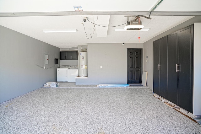 garage with a garage door opener, water heater, and separate washer and dryer