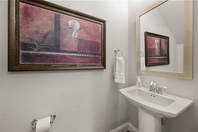 bathroom featuring baseboards