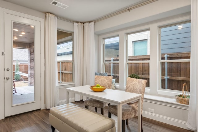 sunroom / solarium featuring visible vents