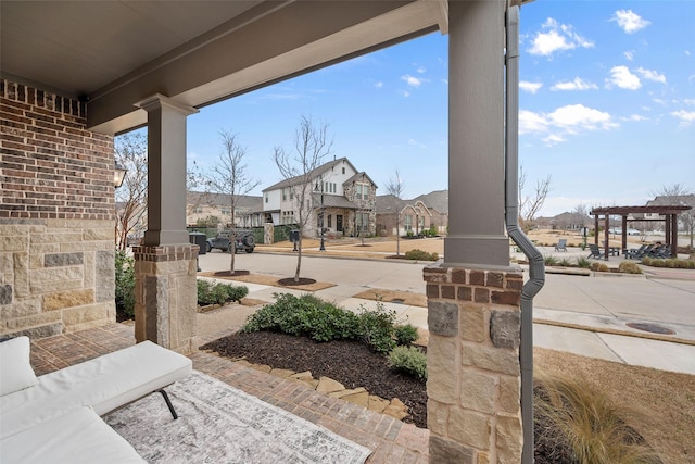 exterior space with a residential view and a pergola