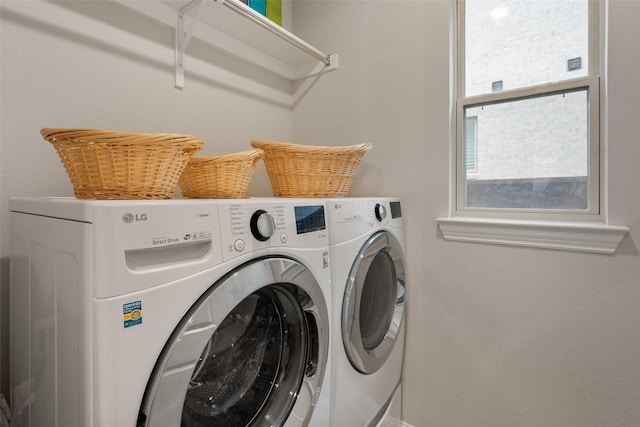 laundry area with laundry area and washer and clothes dryer