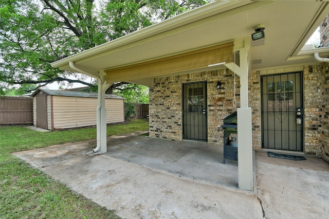 exterior space featuring a storage shed, fence, and an outdoor structure