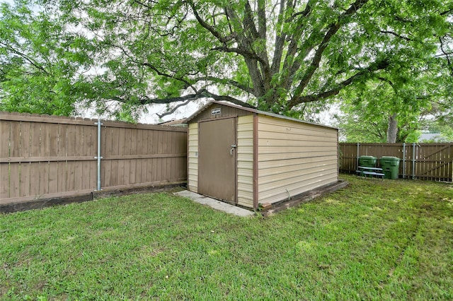 view of shed featuring a fenced backyard