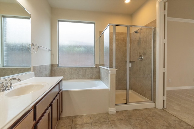 full bathroom with tile patterned flooring, a shower stall, vanity, and a bath