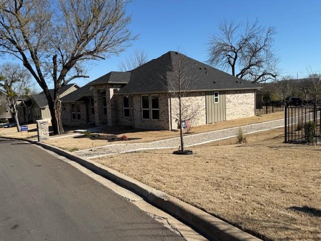 view of front of house featuring fence