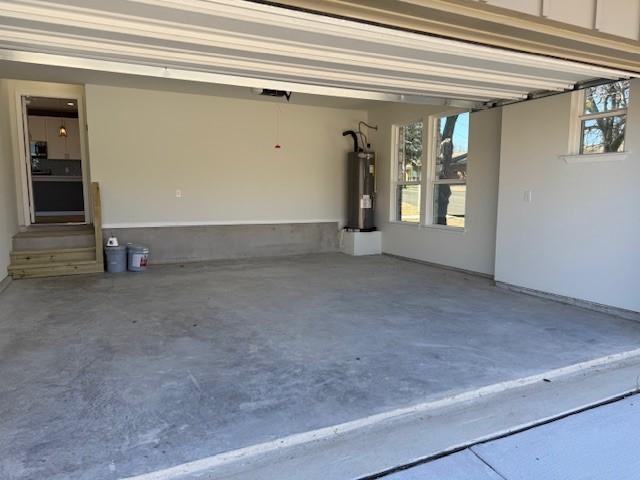 garage featuring electric water heater