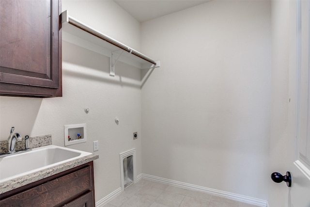 laundry area with hookup for a washing machine, hookup for a gas dryer, hookup for an electric dryer, a sink, and cabinet space