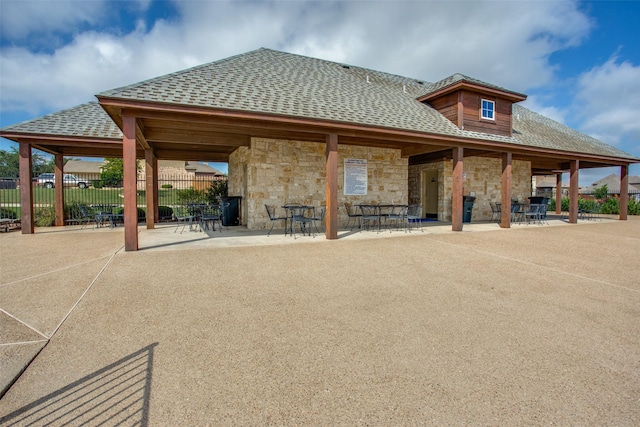 view of home's community with a patio area and fence