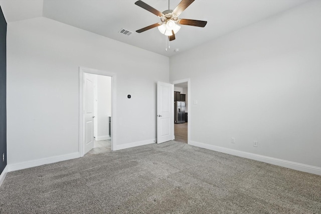 unfurnished bedroom with light carpet, baseboards, visible vents, and built in fridge