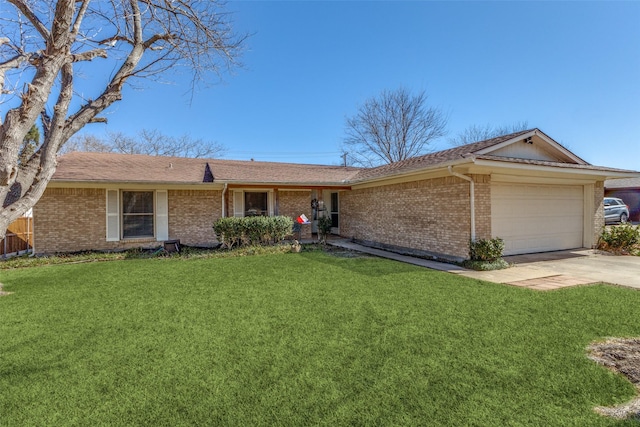 ranch-style house with a front yard, concrete driveway, brick siding, and an attached garage