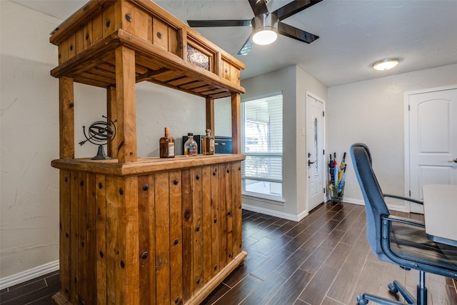 office space featuring baseboards, a ceiling fan, and wood tiled floor