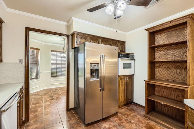 kitchen featuring ceiling fan, ornamental molding, stainless steel appliances, light countertops, and open shelves