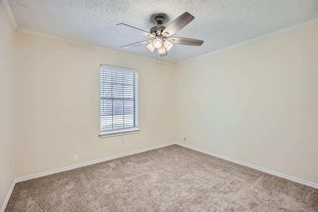 unfurnished room with crown molding, a ceiling fan, carpet flooring, a textured ceiling, and baseboards