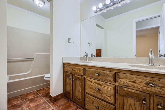 full bathroom with double vanity, ornamental molding, a sink, and toilet