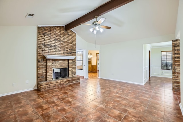 unfurnished living room with vaulted ceiling with beams, visible vents, a ceiling fan, a brick fireplace, and tile patterned floors