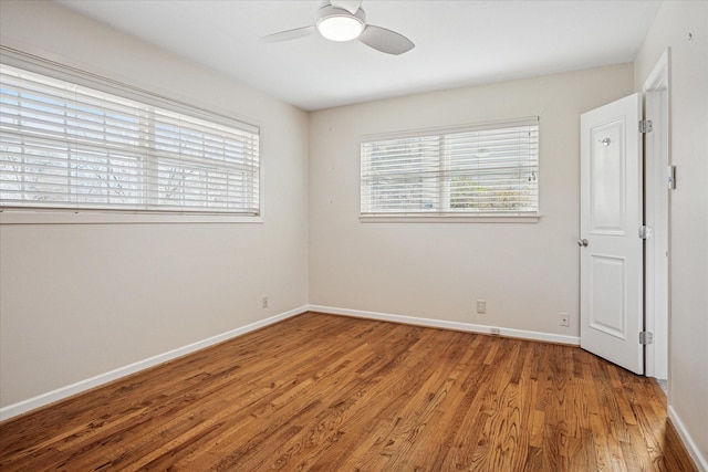 unfurnished room featuring baseboards and a healthy amount of sunlight