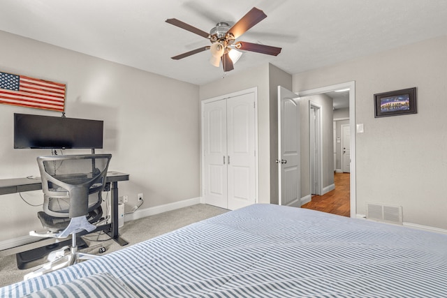 bedroom with visible vents, baseboards, a closet, and a ceiling fan