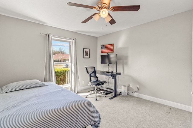 carpeted bedroom featuring a ceiling fan and baseboards