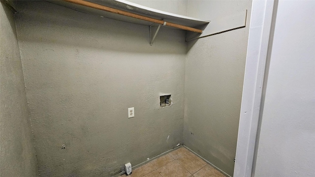 laundry room with laundry area, light tile patterned flooring, and hookup for a washing machine