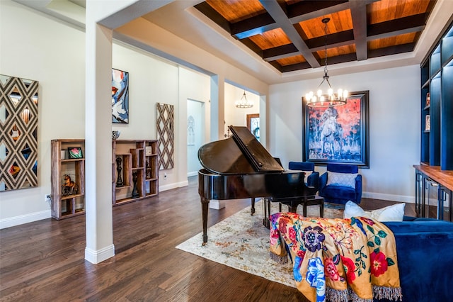 living area with an inviting chandelier, coffered ceiling, baseboards, beam ceiling, and dark wood-type flooring