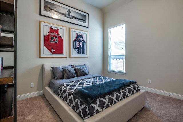 bedroom featuring carpet floors and baseboards