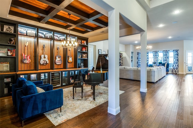 interior space with dark wood finished floors, a chandelier, coffered ceiling, beamed ceiling, and baseboards