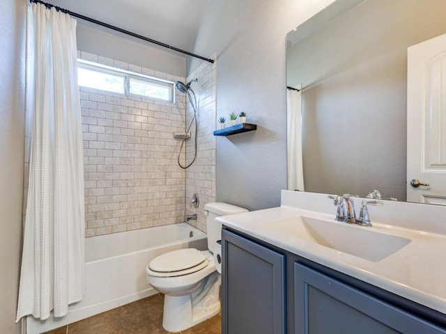 bathroom with shower / tub combo with curtain, a textured wall, toilet, vanity, and tile patterned flooring