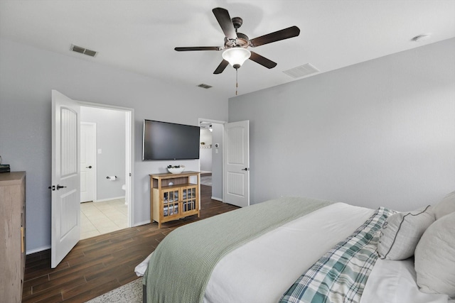 bedroom with visible vents, ceiling fan, baseboards, and wood finished floors