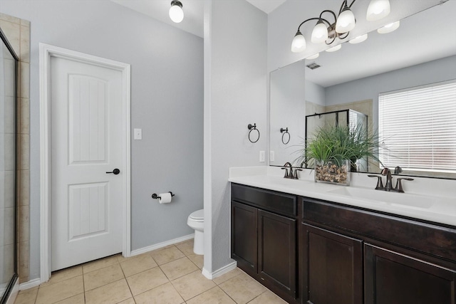 bathroom featuring visible vents, a sink, a shower stall, and tile patterned floors