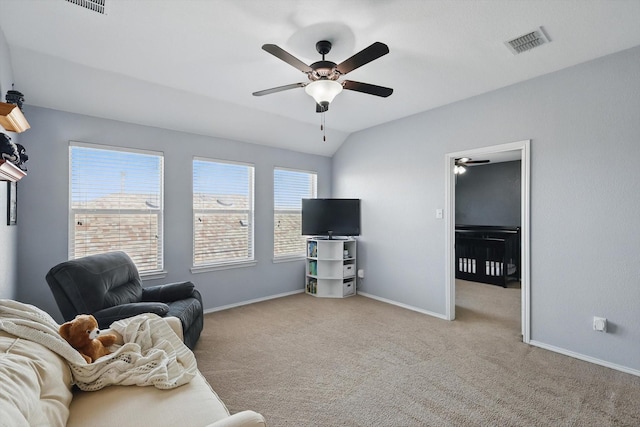 sitting room featuring carpet, visible vents, vaulted ceiling, ceiling fan, and baseboards