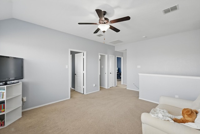 sitting room featuring a ceiling fan, light colored carpet, visible vents, and baseboards