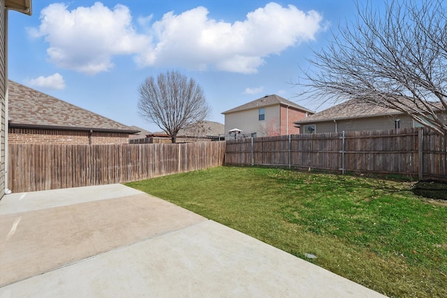 view of yard with a patio area and a fenced backyard