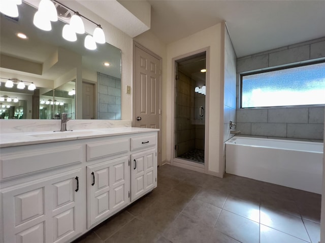 full bathroom featuring a shower stall, vanity, a bath, and tile patterned floors