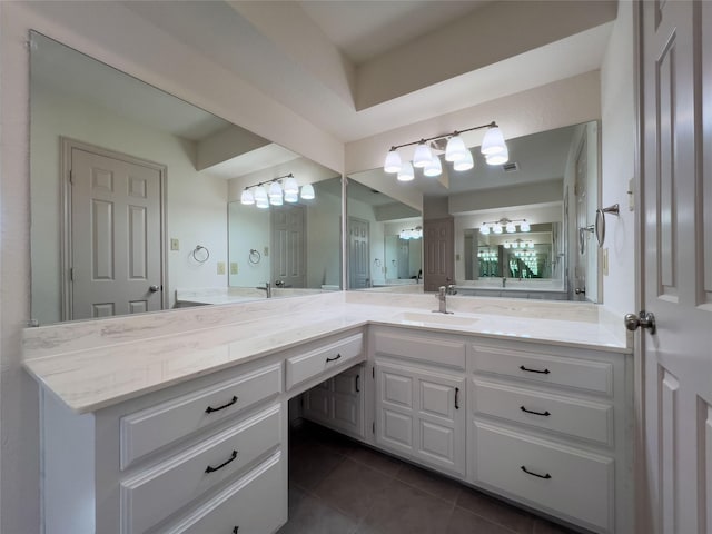 bathroom featuring visible vents, vanity, and tile patterned floors