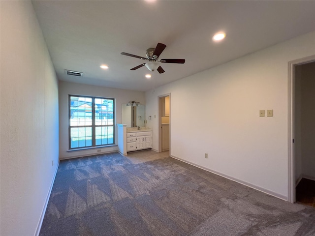 unfurnished bedroom with carpet floors, recessed lighting, visible vents, and baseboards