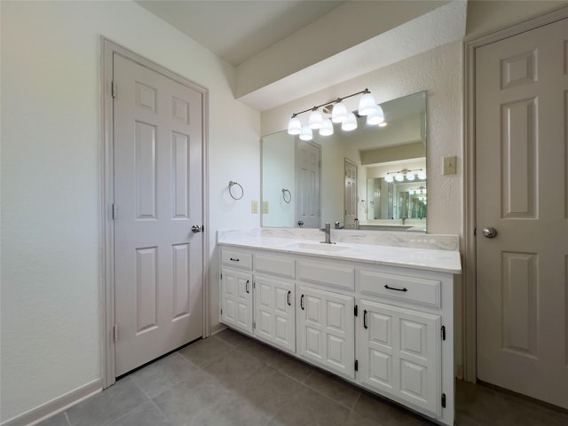 bathroom with tile patterned flooring and vanity