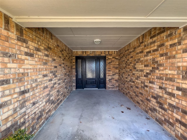 entrance to property with brick siding