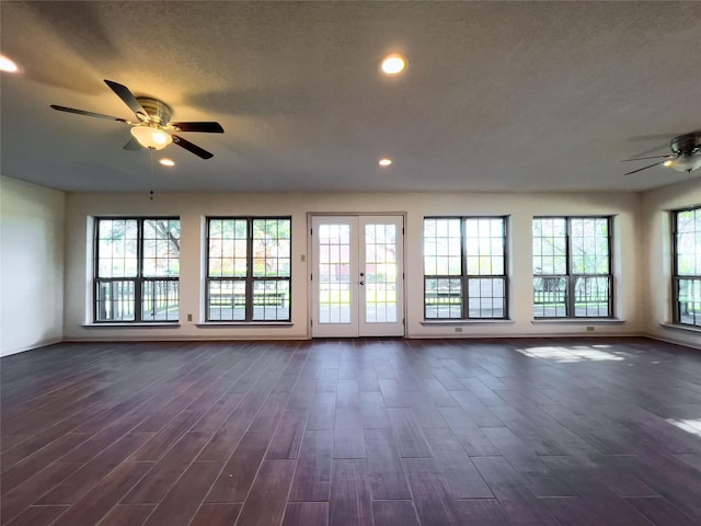 unfurnished living room with ceiling fan, dark wood finished floors, a textured ceiling, and recessed lighting